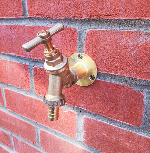 Cold water tap on outside wall